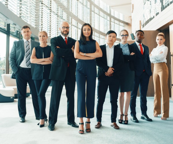 Diverse group of business professional standing in line