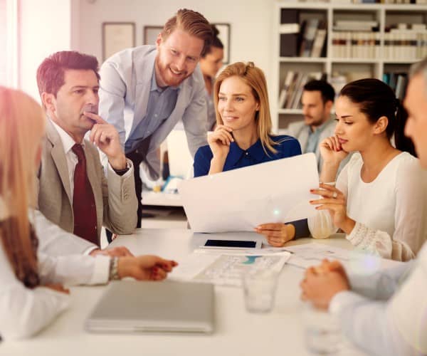 Group of business people having a conversation at a table