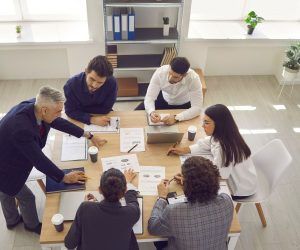 Team of business professionals having a discussion in the office